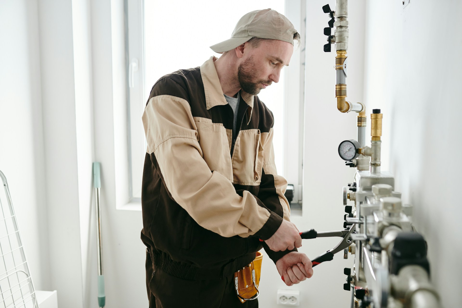 A person holding a hand tool