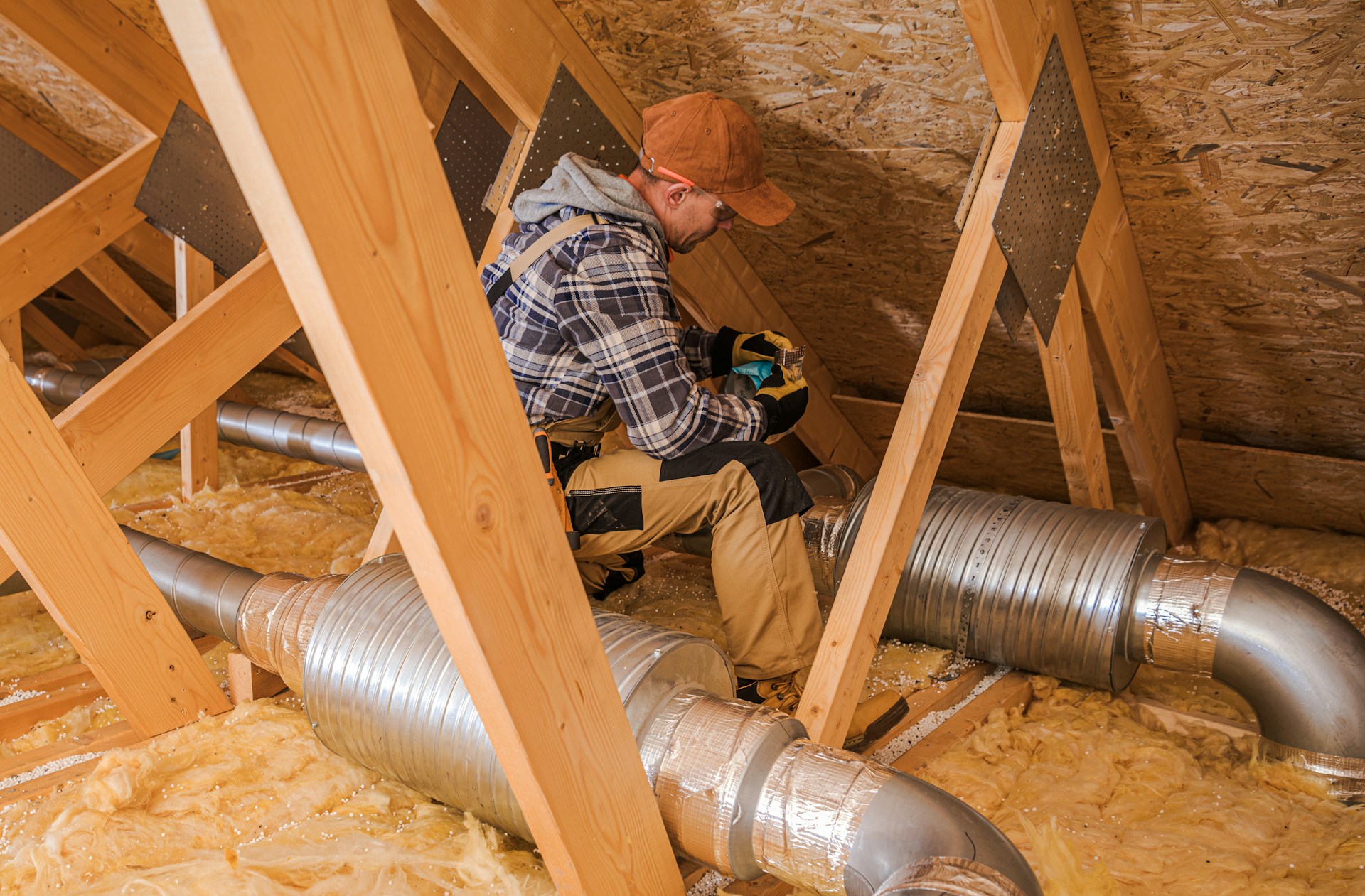 A worker sitting with tubes