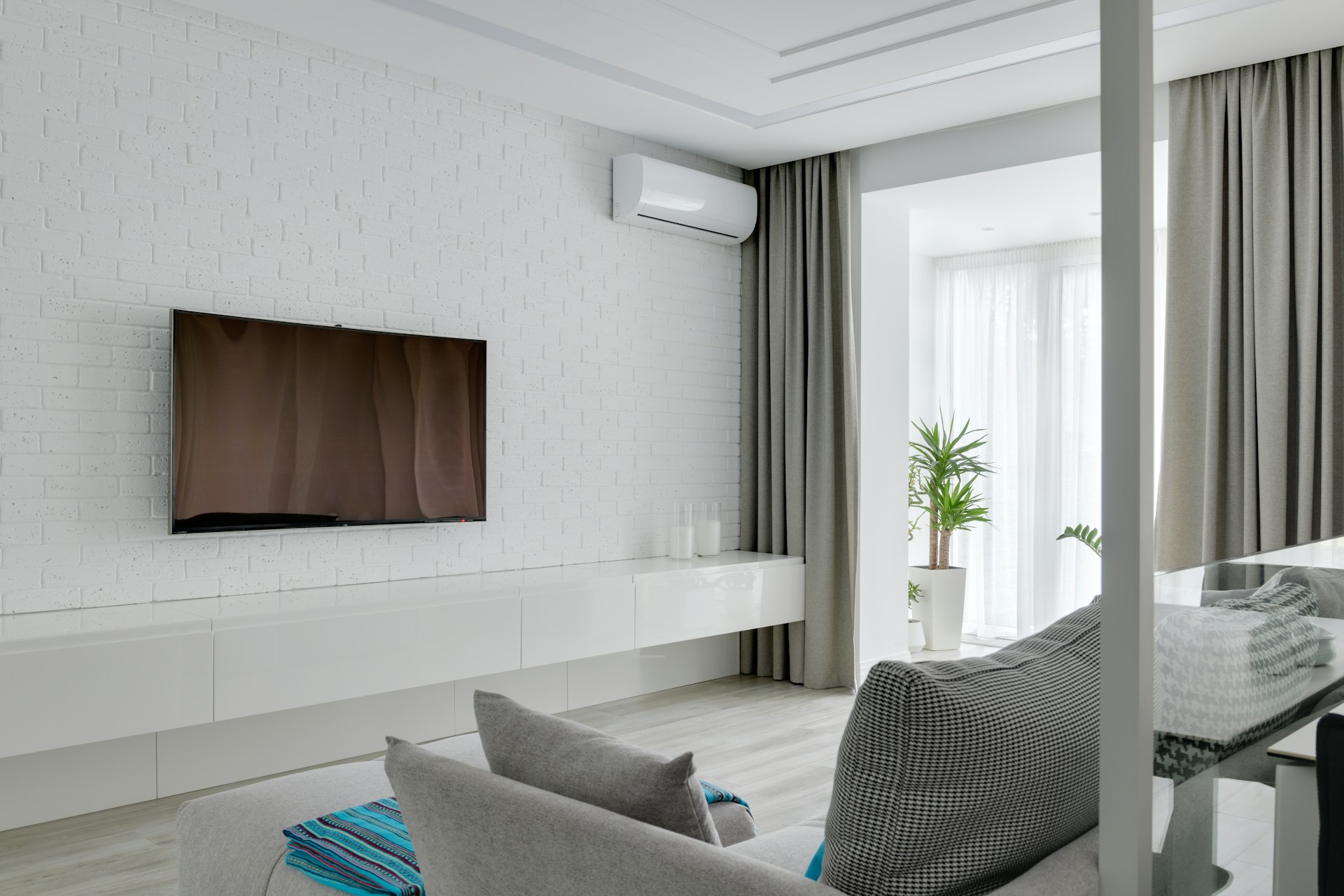 A living room with an air conditioner unit