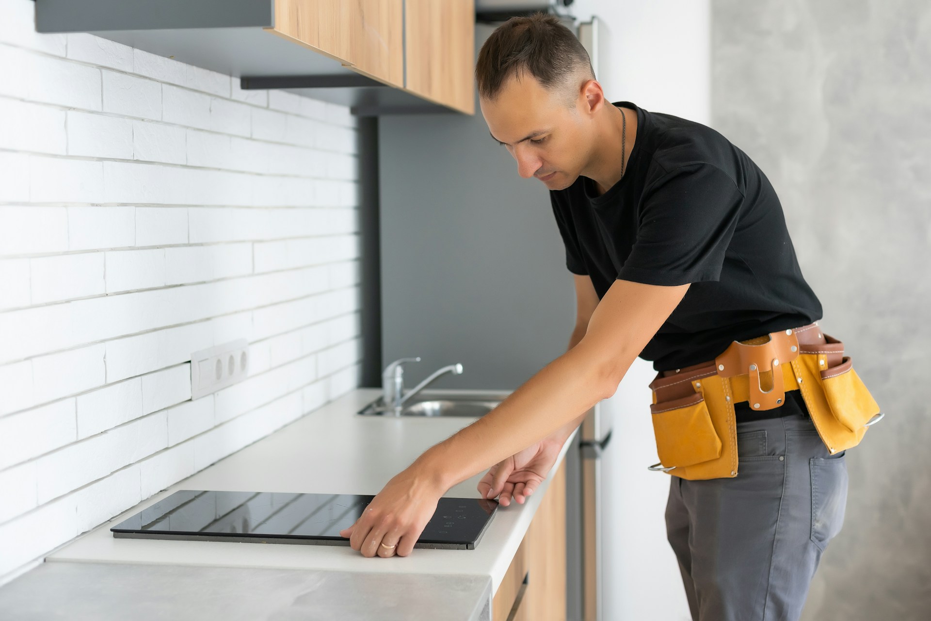 Young repairman working on a table