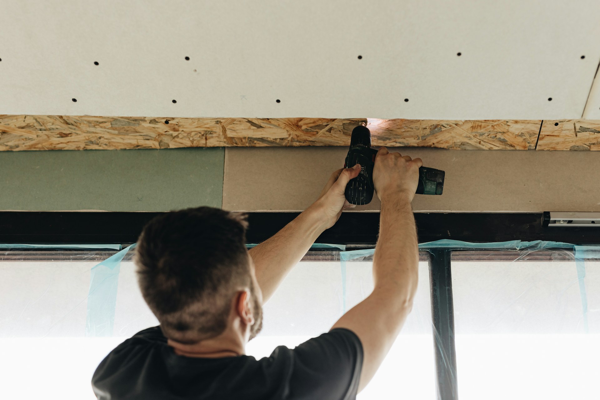 Man holding a hand tool