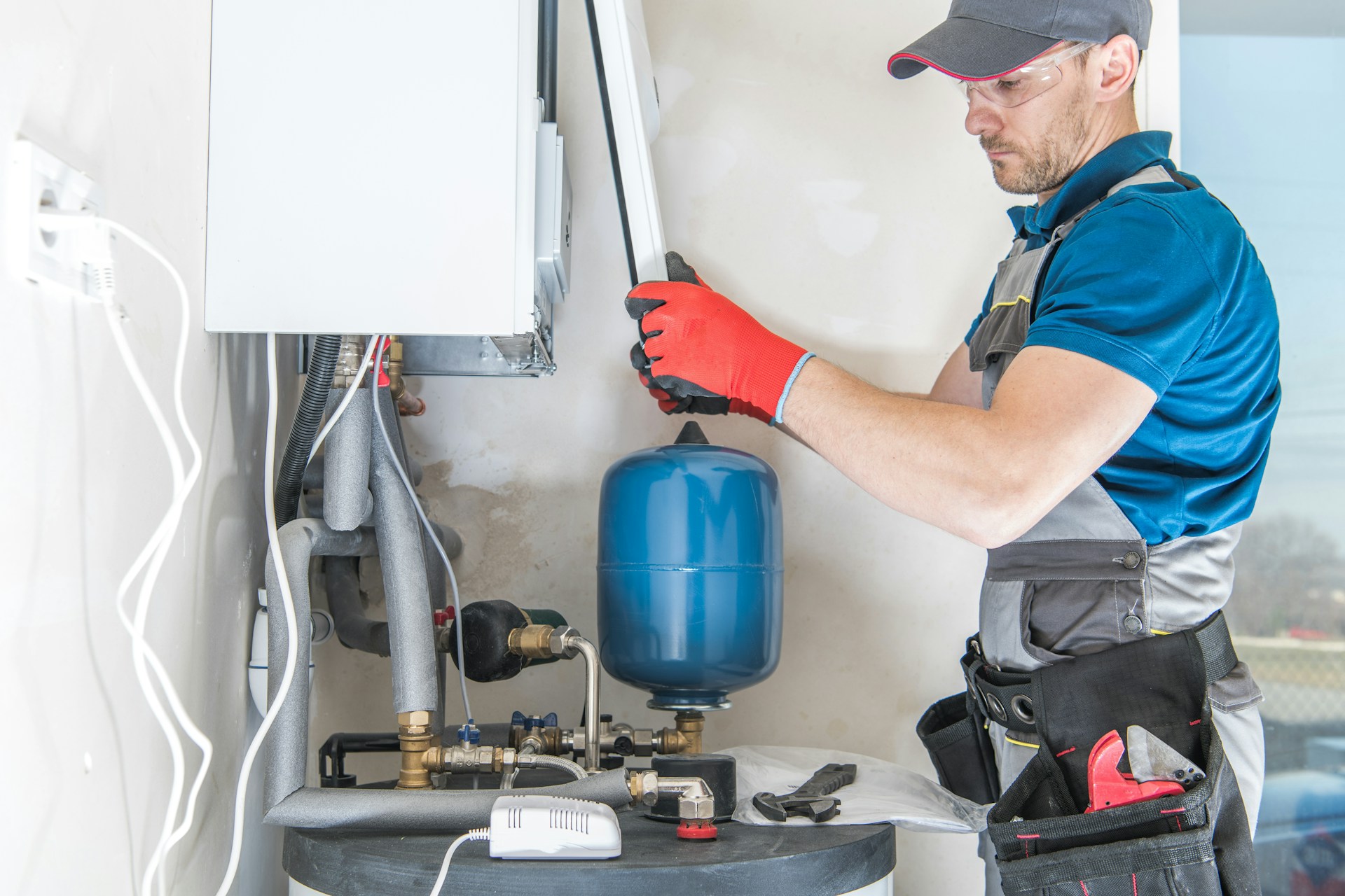 A man installing a gas heater